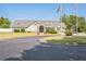 Beautiful community clubhouse featuring an inviting entrance and meticulously maintained landscaping at 6615 Hampton Rock Ln, Cumming, GA 30041