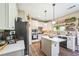 Well-appointed kitchen featuring stainless steel appliances, island, and ample counter space with stylish decor at 6615 Hampton Rock Ln, Cumming, GA 30041