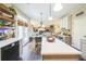 Spacious eat-in kitchen with island, modern appliances, and stylish finishes offering seamless flow to living areas at 6615 Hampton Rock Ln, Cumming, GA 30041