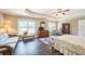 Spacious main bedroom with trey ceiling, hardwood floors and large windows at 6615 Hampton Rock Ln, Cumming, GA 30041