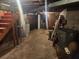 Spacious unfinished basement with exposed ceiling and concrete flooring, perfect for storage at 8587 Cumming Hwy, Canton, GA 30115
