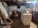 Unfinished basement with exposed ceiling and concrete flooring, ready for renovation at 8587 Cumming Hwy, Canton, GA 30115
