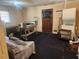 Spacious basement with laundry machines, various furniture, and a back door at 8587 Cumming Hwy, Canton, GA 30115