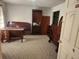 Bedroom with neutral carpet and vintage furniture at 8587 Cumming Hwy, Canton, GA 30115