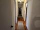 Hallway with hardwood floors and a long layout at 8587 Cumming Hwy, Canton, GA 30115