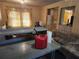 View from living room into adjacent kitchen space, revealing a project in progress at 8587 Cumming Hwy, Canton, GA 30115