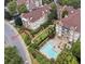 Aerial view showing unit's location within the building and proximity to the community pool and other green areas at 220 Renaissance Pkwy # 1203, Atlanta, GA 30308