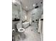 Modern bathroom with white marble walls, a luxurious soaking tub, and a glass-enclosed shower at 220 Renaissance Pkwy # 1203, Atlanta, GA 30308