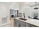 Bright, modern kitchen with view into the living and dining areas at 220 Renaissance Pkwy # 1203, Atlanta, GA 30308