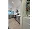 Modern kitchen featuring stainless steel appliances, gray cabinets, and a convenient laundry area with a washing machine at 220 Renaissance Pkwy # 1203, Atlanta, GA 30308