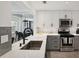Beautiful modern kitchen with stainless appliances and view into the dining room at 220 Renaissance Pkwy # 1203, Atlanta, GA 30308