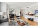 Spacious and bright living room with open floor plan leading to the dining and kitchen areas at 220 Renaissance Pkwy # 1203, Atlanta, GA 30308