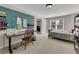 Bedroom featuring a bed, a desk, and a pegboard to keep everything organized at 3641 Carriage Glen Way, Dacula, GA 30019