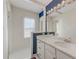 Clean bathroom with white vanity and blue accent wall at 14 Newport Nw Pl, Atlanta, GA 30318