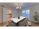 Elegant dining room with hardwood floors and chandelier at 14 Newport Nw Pl, Atlanta, GA 30318