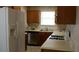 Galley kitchen with stainless steel appliances and light oak cabinets at 1969 Corners Cir, Lithonia, GA 30058