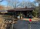 Brick ranch house with carport and mature trees at 224 Hollis St, Rutledge, GA 30663