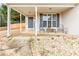 Charming front porch with seating, decorative rocks, and a view of the home's entrance at 5515 Hancock Ln, Cumming, GA 30041