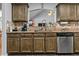 Kitchen with granite countertops, wood cabinets, and stainless steel appliances at 5515 Hancock Ln, Cumming, GA 30041