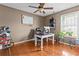 Home office with hardwood floors, large window for natural light, and neutral wall color at 5515 Hancock Ln, Cumming, GA 30041
