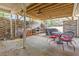 Covered patio featuring outdoor seating, a ceiling fan, and a view of the yard at 5515 Hancock Ln, Cumming, GA 30041