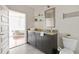 Modern bathroom with granite vanity and walk-in shower at 1080 Peachtree St # 2406, Atlanta, GA 30309