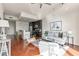 Open concept living room with hardwood floors and kitchen view at 1080 Peachtree St # 2406, Atlanta, GA 30309