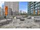 Outdoor patio area with comfortable seating and string lights at 1080 Peachtree St # 2406, Atlanta, GA 30309