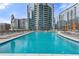 Inviting rooftop pool with city views and lounge chairs at 1080 Peachtree St # 2406, Atlanta, GA 30309