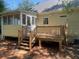 Home features a wooden deck with stairs and screened porch at 2351 Johnson Ferry Ne Rd, Chamblee, GA 30341