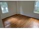 Simple bedroom with hardwood floors and bright natural light at 2351 Johnson Ferry Ne Rd, Chamblee, GA 30341