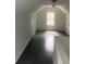 Bright bonus room with a window and dark hardwood floors at 2351 Johnson Ferry Ne Rd, Chamblee, GA 30341