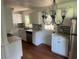 Bright kitchen with white cabinets, granite countertops and hardwood floors at 2351 Johnson Ferry Ne Rd, Chamblee, GA 30341