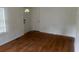 Living room featuring hardwood floors and wood paneled walls at 2351 Johnson Ferry Ne Rd, Chamblee, GA 30341