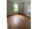 Living room with hardwood floors and multiple windows at 2351 Johnson Ferry Ne Rd, Chamblee, GA 30341