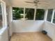Bright screened porch with light wood floors at 2351 Johnson Ferry Ne Rd, Chamblee, GA 30341