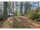 View of the backyard with the patio and back of house on the left at 3881 Bonnie Se Ln, Atlanta, GA 30354