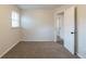 Inviting bedroom with neutral walls, carpet, and a door leading to another room, offering a comfortable and spacious retreat at 3881 Bonnie Se Ln, Atlanta, GA 30354