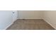 Neutral bedroom featuring carpet, white door and walls providing a blank canvas for personalization at 3881 Bonnie Se Ln, Atlanta, GA 30354