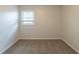 Bedroom featuring neutral walls, carpet and natural light through a window, ideal for rest and relaxation at 3881 Bonnie Se Ln, Atlanta, GA 30354