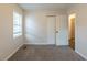 This bedroom features neutral walls, carpet, and ample natural light, creating a tranquil and comfortable space at 3881 Bonnie Se Ln, Atlanta, GA 30354