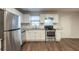 Modern kitchen featuring stainless steel appliances, granite countertops, and white subway tile backsplash at 3881 Bonnie Se Ln, Atlanta, GA 30354