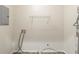 This laundry room offers essential utility hookups and a white wire rack for storage at 3881 Bonnie Se Ln, Atlanta, GA 30354