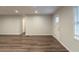 Bright living room showcasing new laminate flooring, fresh paint, and ample natural light at 3881 Bonnie Se Ln, Atlanta, GA 30354