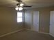 Bright bedroom with ceiling fan and window at 5112 Central Church Rd, Douglasville, GA 30135