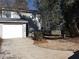 Gray siding two-story house with white garage door at 5112 Central Church Rd, Douglasville, GA 30135