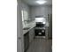 Renovated kitchen with granite countertops and stainless steel appliances at 5112 Central Church Rd, Douglasville, GA 30135
