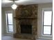 Living room with stone fireplace and built-in mantle at 5112 Central Church Rd, Douglasville, GA 30135