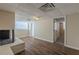 Basement features wood-look floors, painted brick fireplace, and neutral paint at 2919 Alameda Trl, Decatur, GA 30034