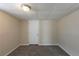 Finished basement with carpeting, neutral walls, and a door to another area at 2919 Alameda Trl, Decatur, GA 30034